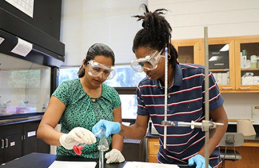 students in chemistry lab learn how to titer liquids